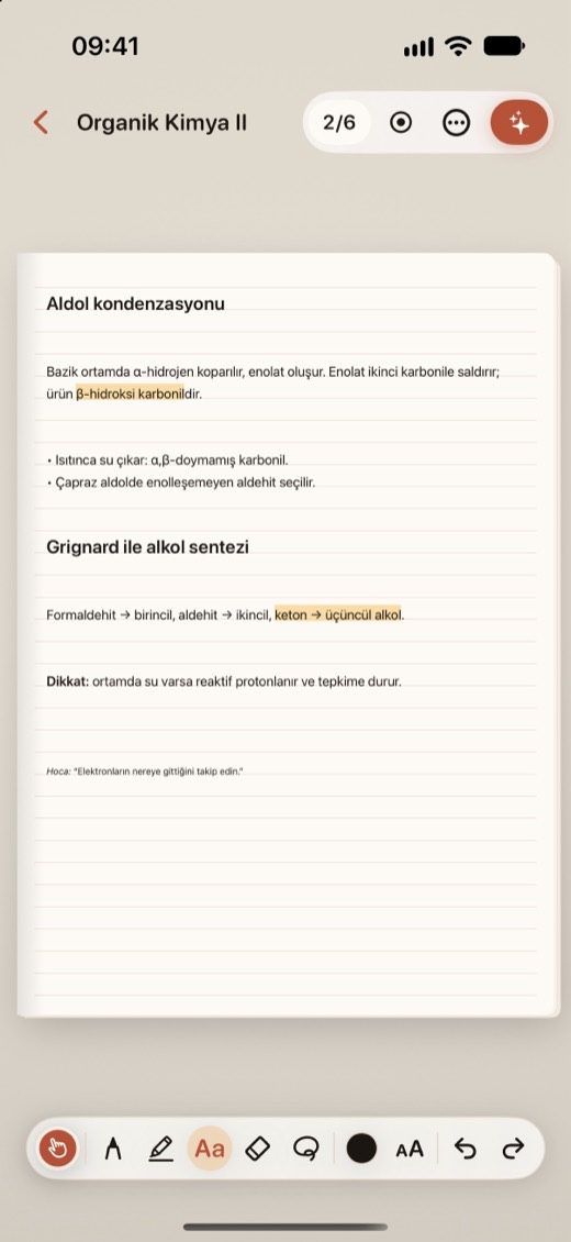 iPhone'da defter sayfasında klavyeyle yazılmış metin kutusu.